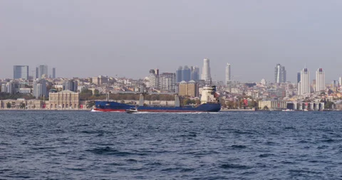 Cargo ship sailing on the Bosphorus strait in Istanbul, Turkey Stock Footage 318675700