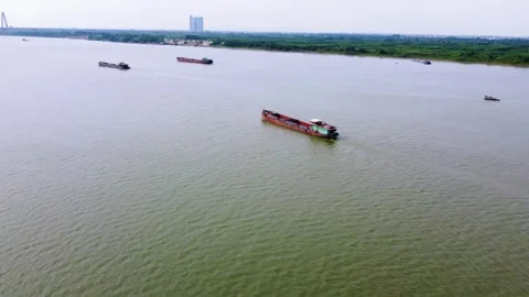 A cargo ship sailing down a river Stock Footage 242515835