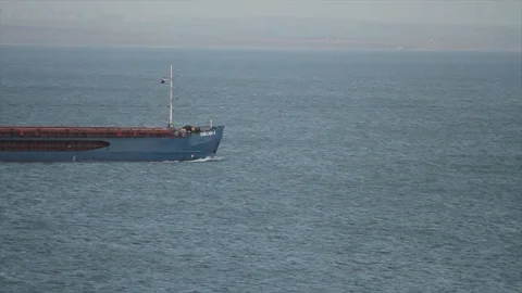 Cargo ship sailing in ocean, shipping business concept. Shot. Cargo ship is Stock Footage 97356295