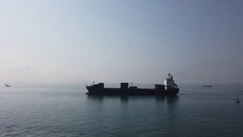 A cargo ship sailing to the port to load cargo Stock Footage 123746894