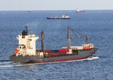 Cargo ship sailing on the sea Stock Photos