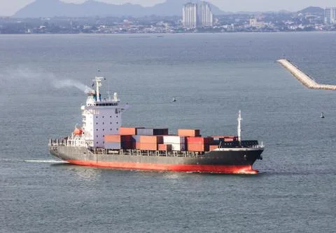 Cargo ship sailing on the sea Stock Photos