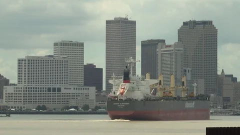 Cargo ship sailing on sea towards cityscape Stock Footage 84512689