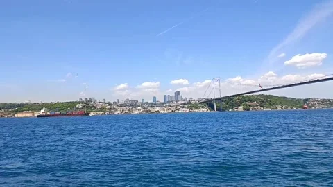 Cargo ship sailing towards the Black Sea under the Bosphorus Bridge in Istanbul Stock Footage 310491724
