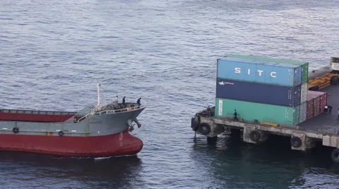 A cargo ship sails into container terminal in Hong Kong Stock Footage 45410135