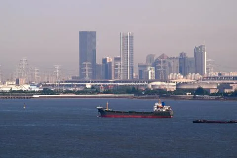 Cargo ship sails on the sea befor skyline Stock Photos
