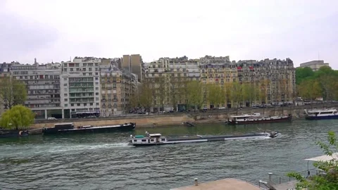Cargo ship sails on the Seine river in Paris on a cloudy winter day Stock Footage 173552790