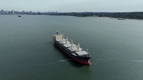 A Cargo Ship Sails Through the Calm Waters Near Jericho Beach, With the Stock Footage 333528503