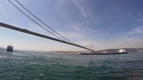 Cargo ship sails under the Bosphorus Bridge 스톡 동영상 49879487