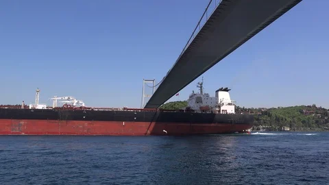 Cargo ship sails under the Bosphorus Bridge,  Turkey, Istanbul Stock Footage 97177844