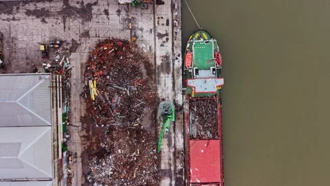 Cargo ship at shipyard loading materials for transport Stock Footage 337942321