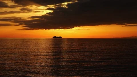Cargo ship silhouette distant ocean sunset Bogliasco Italy Stock Footage 326465257