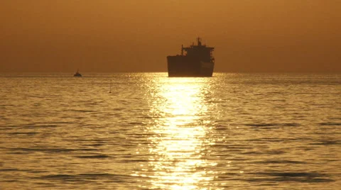 Cargo ship silhouette at sunset Stock-Footage 30842432