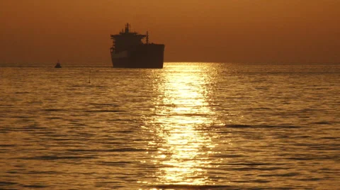 Cargo ship silhouette at sunset Stock-Footage 30842489