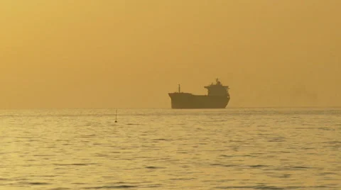 Cargo ship silhouette at sunset Stock-Footage 30928992