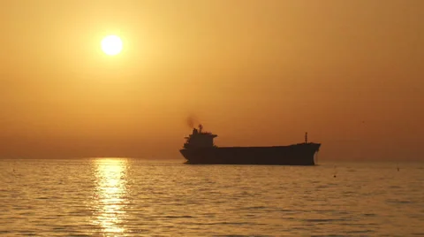 Cargo ship silhouette at sunset Video stock 30929210