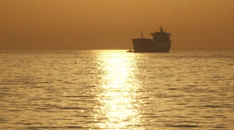 Cargo ship silhouette at sunset Stock-Footage 30929926
