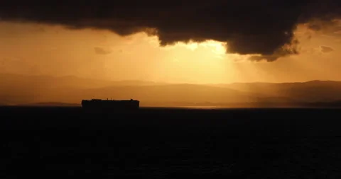 Cargo Ship Silhouette Under Clouds Stock Footage 215103346
