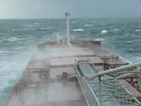 Cargo ship in a storm. Stock Photos