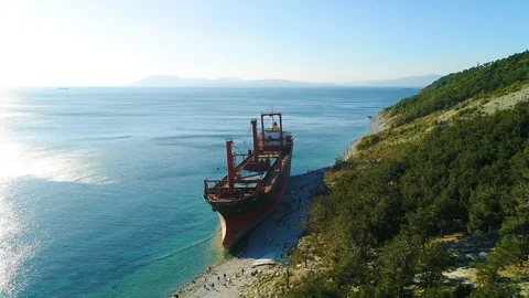 Cargo Ship is Stranded. The Storm Washed the Vessel Ashore. Aerial View Stock Footage 105718609