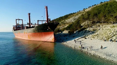 Cargo Ship is Stranded. The Storm Washed the Vessel Ashore. Aerial View Stock Footage 105724421