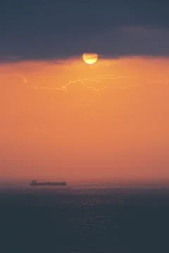 Cargo ship at sunset Stock Photos