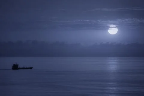 Cargo ship at sunset Stock Photos