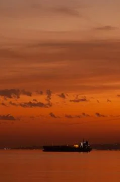 Cargo ship in sunset Stock Photos