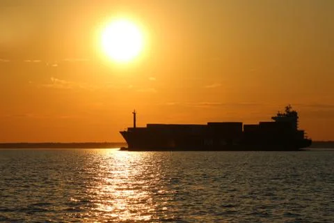 Cargo Ship At Sunset Stock Photos