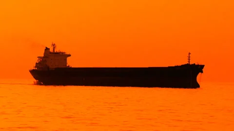 Cargo ship at sunset in the sea Stock Footage 30841108