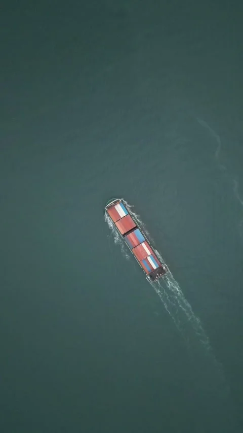 Cargo Ship Transporting Containers Across Open Sea Water in Hong Kong Stock Footage 335811274
