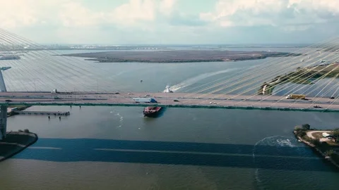 Cargo ship travelling under Fred Hartman Bridge, Baytown, Texas Stock Footage 292870049