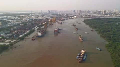 Cargo Ship with tug boats docking at the port tug boats from aerial hyperlapse Stock Footage 333176175