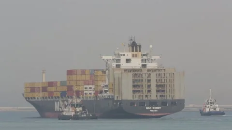 Cargo Ship With Tugboats In Harbor Stock Footage 63085937