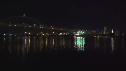 Cargo ship turning around on Willamette River at night - 4K Stock Footage 107810938