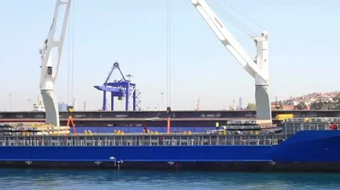 Cargo ship under loading in sea port Stock Footage 8986950
