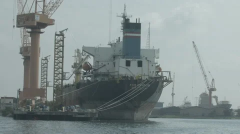 Cargo Ship Is Unloaded At The Port Stock Footage 65741801