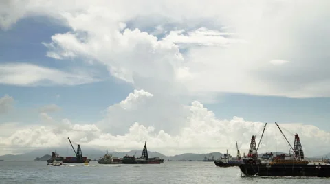 Cargo ship unloading containers in harbour Stock Footage 53211687