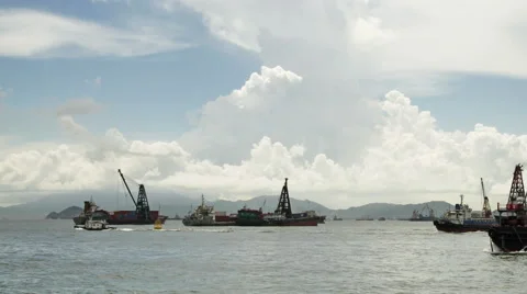 Cargo ship unloading containers in harbour Stock Footage 53805607