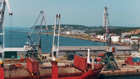 Cargo ship unloading in a seaport Korsakov. South Sakhalinsk. Stock Footage 121694016