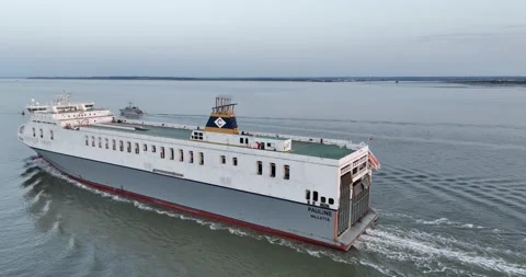 Cargo ship on vast water surface, ferry boat at twilight Video stock 202150430