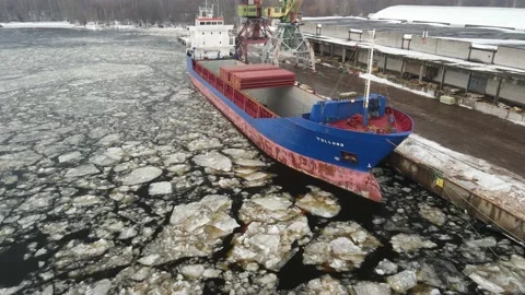 Cargo ship in winter port Stock Footage 149033843