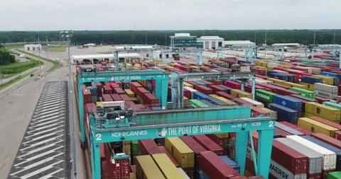 Cargo shipping containers being moved by crane Stock Footage 202142345