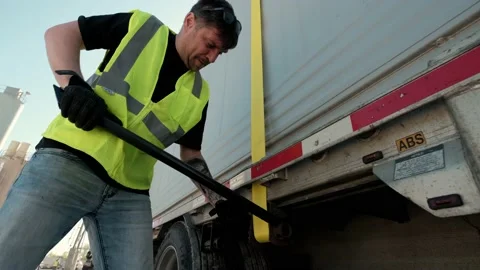 Cargo shipping. Men workers fasten the load on the truck. Close up futage 4k Stock Footage 157714122