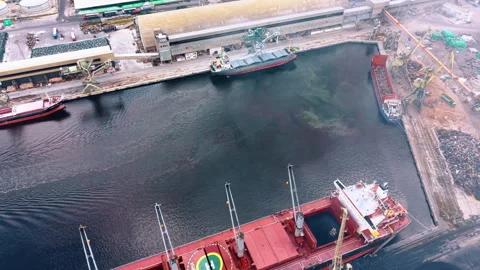Cargo ships berthed at port quay for loading Vídeos de archivo 342327128