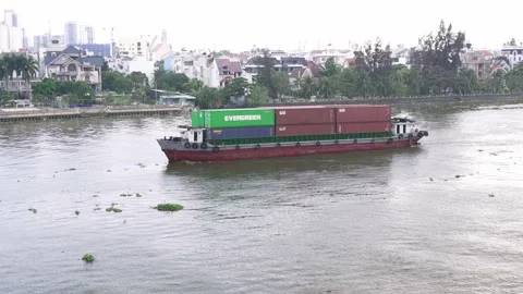Cargo ships export goods through along riverside urban Stock Footage 155871412