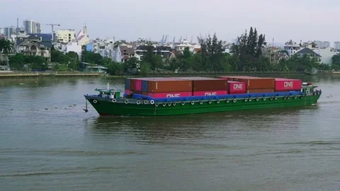 Cargo ships export goods through along riverside urban Stock Footage 155871430