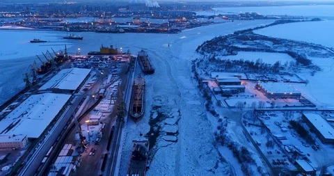 Cargo ships on loading in the port. Winter, sunset, ice. 動画素材 86729316