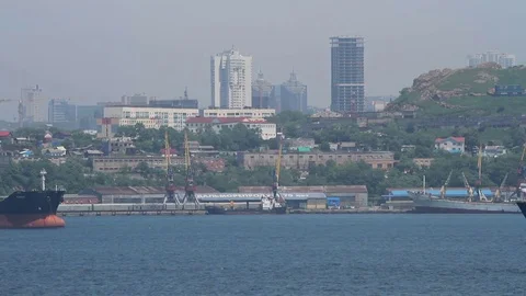 Cargo ships navigate in the strait in summer day Stock Footage 77789561