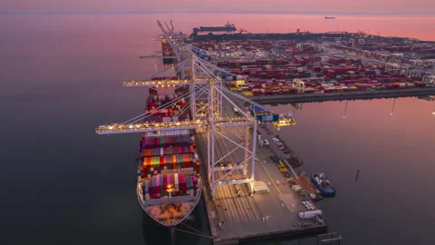 Cargo terminal loading shipping containers onto cargo ships, aerial footage Stock Footage 219790656